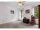 Bright bedroom with neutral walls, plush carpet, two windows and a ceiling fan at 133 37Th Avenue Nw Pl, Hickory, NC 28601