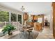 Eat-in kitchen area with breakfast table, cabinetry, light tile flooring, and outdoor views at 133 37Th Avenue Nw Pl, Hickory, NC 28601