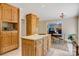 Kitchen with center island, oak cabinetry, and view of Gathering room with fireplace at 133 37Th Avenue Nw Pl, Hickory, NC 28601