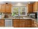 Close-up of sink, counter, and window in the kitchen. Good natural lighting at 133 37Th Avenue Nw Pl, Hickory, NC 28601