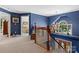 Upstairs landing with chandelier and hardwood stairs at 133 37Th Avenue Nw Pl, Hickory, NC 28601