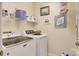 Laundry room with washer, dryer, wire shelf, and neutral walls at 133 37Th Avenue Nw Pl, Hickory, NC 28601