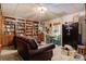 Living room features a bookcase, dining table, a large safe and natural light at 133 37Th Avenue Nw Pl, Hickory, NC 28601