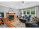 Cozy living room with hardwood floors, a fireplace, and natural light from outdoor views at 133 37Th Avenue Nw Pl, Hickory, NC 28601