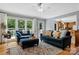 Bright living room with large windows, comfortable seating, and hardwood floors that create a welcoming space at 133 37Th Avenue Nw Pl, Hickory, NC 28601
