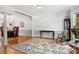 Bright living room with hardwood floors, elegant columns, and a neutral color palette at 133 37Th Avenue Nw Pl, Hickory, NC 28601
