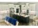 Spacious kitchen featuring white cabinets, stainless steel appliances, and a large island with seating at 133 Harbourtown Dr, Kings Mountain, NC 28086