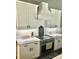 Close-up of the kitchen with white cabinets, subway tile backsplash, and stainless steel appliances at 133 Harbourtown Dr, Kings Mountain, NC 28086