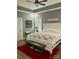 Cozy bedroom with a white bed frame, red rug, and gray walls at 133 Harbourtown Dr, Kings Mountain, NC 28086