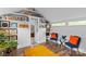 Bright bonus room featuring built-in bookshelves, a small seating area, and unique decor at 1729 Kensington Dr, Charlotte, NC 28205