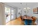 Elegant dining room with modern chandelier and access to outdoor patio at 1729 Kensington Dr, Charlotte, NC 28205