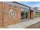 Modern brick building featuring Mezz Market, with a contemporary logo and design elements at 1729 Kensington Dr, Charlotte, NC 28205