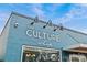 Modern blue building for The Culture Shop, featuring a clean design and large windows at 1729 Kensington Dr, Charlotte, NC 28205