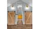 Hallway featuring barn doors on each side and an open door leading to the next room at 1729 Kensington Dr, Charlotte, NC 28205