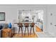 Open kitchen boasts bar seating, white cabinetry, and stainless appliances at 1729 Kensington Dr, Charlotte, NC 28205