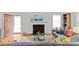 Cozy living room with a fireplace, hardwood floors, and contemporary decor at 1729 Kensington Dr, Charlotte, NC 28205