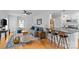 Cozy living room with direct kitchen access, hardwood floors, and neutral-toned furniture at 1729 Kensington Dr, Charlotte, NC 28205