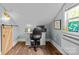 Upstairs office featuring built-in shelves, barn door, and a modern desk at 1729 Kensington Dr, Charlotte, NC 28205