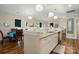 Bright, open kitchen area, seamlessly connects with the adjacent dining space, creating an inviting atmosphere at 204 Craig St, Mount Holly, NC 28120