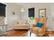 Inviting living room featuring comfortable armchairs, ample natural light, and stylish decor, creating a relaxing atmosphere at 204 Craig St, Mount Holly, NC 28120