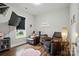 A cozy living room featuring two leather recliners, a wall-mounted TV, and a cute teddy bear at 204 Craig St, Mount Holly, NC 28120