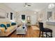 Inviting living room with hardwood floors, high ceilings, and comfortable seating area with plentiful decor at 204 Craig St, Mount Holly, NC 28120