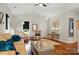 Cozy living room with comfortable seating, high ceilings, and elegant decor, designed for relaxation and entertainment at 204 Craig St, Mount Holly, NC 28120