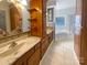 Bathroom featuring a double vanity with cabinets, tile flooring, and a tub at 204 W Boyd St, Maiden, NC 28650
