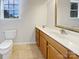 Bathroom featuring a toilet, vanity, and medicine cabinet at 204 W Boyd St, Maiden, NC 28650