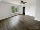 Cozy bedroom showcases a ceiling fan and dark hardwood flooring at 204 W Boyd St, Maiden, NC 28650