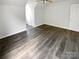 This bedroom has a ceiling fan, hardwood floors, and bright white walls at 204 W Boyd St, Maiden, NC 28650