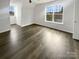 Bright bedroom features hardwood floors and a large window that provides natural light at 204 W Boyd St, Maiden, NC 28650