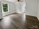 Bright and airy room featuring hardwood floors and natural light through two windows at 204 W Boyd St, Maiden, NC 28650
