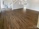 Welcoming entryway with beautiful hardwood floors and staircase leading upstairs at 204 W Boyd St, Maiden, NC 28650