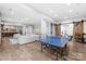Finished basement with rec area, ping pong table, and a bar, perfect for entertainment at 2289 Pine Valley Dr, Denver, NC 28037
