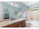 Stylish bathroom showcasing granite countertops, a bathtub with a shower, and a modern toilet at 2289 Pine Valley Dr, Denver, NC 28037