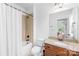 Neutral bathroom featuring a granite countertop, tub with shower, and modern toilet at 2289 Pine Valley Dr, Denver, NC 28037