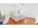 Bright bedroom with hardwood floors, featuring a vanity and a neutral color palette at 2289 Pine Valley Dr, Denver, NC 28037