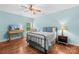 Charming bedroom features hardwood floors and blue accents, complemented by natural light at 2289 Pine Valley Dr, Denver, NC 28037