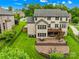 A beautiful home with a large yard, a two-tiered deck, and a brick patio, perfect for entertaining at 2289 Pine Valley Dr, Denver, NC 28037