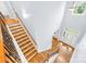 Grand foyer featuring hardwood floors, a staircase with rod iron railings, and a view of the front door at 2289 Pine Valley Dr, Denver, NC 28037