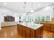 Open kitchen with granite countertops, stainless steel appliances, and hardwood flooring at 2289 Pine Valley Dr, Denver, NC 28037