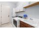 Functional laundry room equipped with modern washer, dryer, and a utility sink at 2289 Pine Valley Dr, Denver, NC 28037