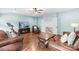 Cozy living room with hardwood floors, comfortable seating, and a mounted television at 2289 Pine Valley Dr, Denver, NC 28037