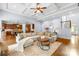 Spacious living room featuring a coffered ceiling, hardwood floors, and modern decor at 2289 Pine Valley Dr, Denver, NC 28037