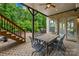 Cozy patio with a dining set and a staircase leading to the deck, perfect for outdoor entertaining at 2289 Pine Valley Dr, Denver, NC 28037