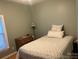 Cozy bedroom featuring neutral tones, a comfortable bed, and a window for natural light at 2310 Gill Jordan Rd, Chester, SC 29706