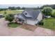 Aerial view of home featuring an attached garage, stone chimney, and well-manicured landscaping at 2310 Gill Jordan Rd, Chester, SC 29706