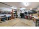 Cluttered garage with concrete floor, tool bench, shelving, and door to the outside at 2310 Gill Jordan Rd, Chester, SC 29706