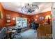 Office with gray and red walls, light fixture, window view, and ceiling fan at 2310 Gill Jordan Rd, Chester, SC 29706